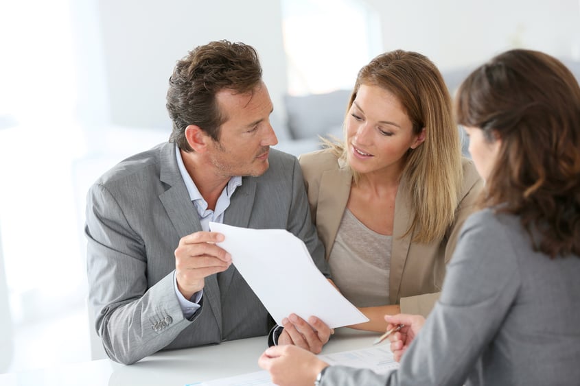 Couple meeting financial adviser for loan granting