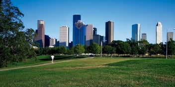 Exterior skyline of beautiful Houston, Texas with skyscrapers and a green park